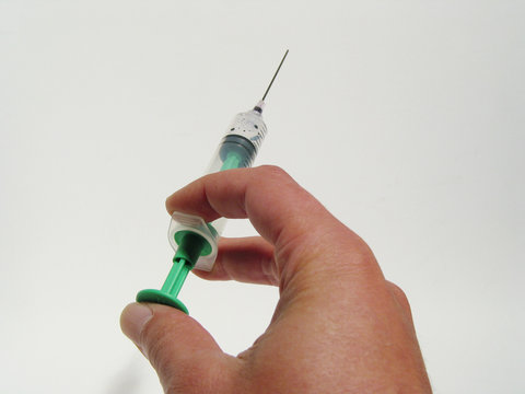 hand using an injection