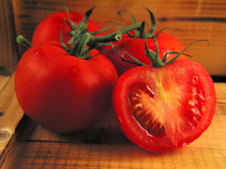red tomatoes on wood