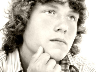 close up of sixteen year old teen boy in sepia