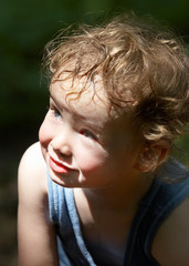 curly kid, staring frowningly