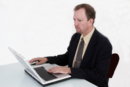 business man working on a notebook computer