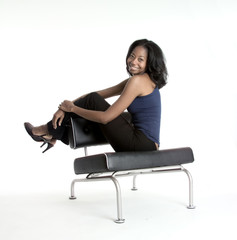 smiling girl seated on a chair