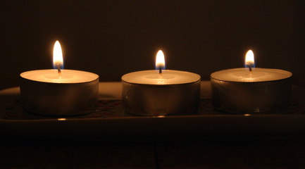 Obraz na płótnie Canvas three candles