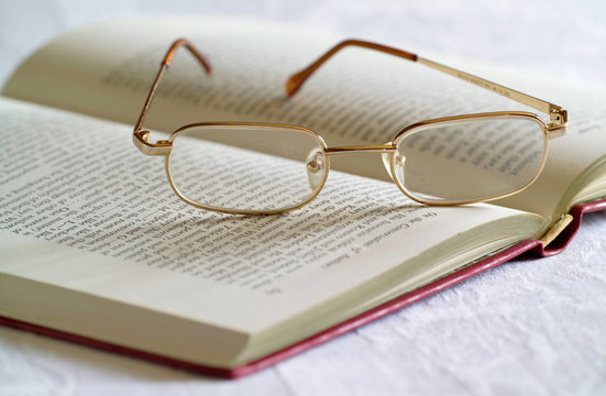 spectacles and book