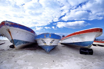 boats on beach and beautiful sky with clouds mexic