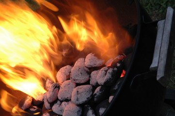 flaming charcoals in kettle