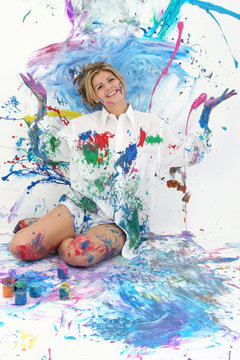 beautiful young woman covered in paint