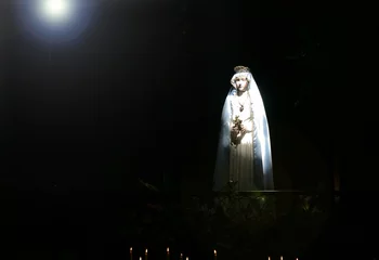 Foto op Canvas madonna staue in church light beam © soundsnaps
