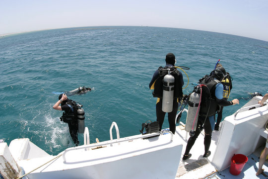 divers entering water