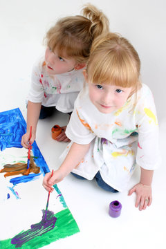 young friends painting together