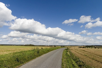 Fototapeta na wymiar sunny windmill and a road