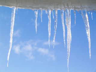 icicles against a blue sky