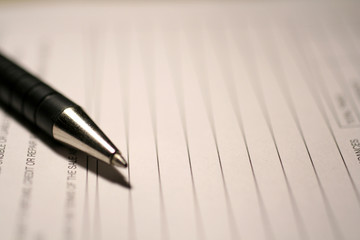 Fototapeta premium office document and a ballpoint pen