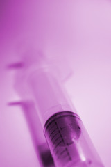 syringe over purple