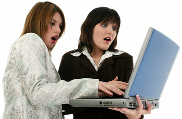 two beauitiful young business women with laptop