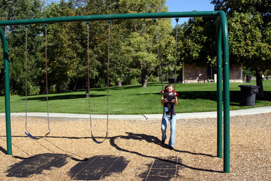 little boy swinging