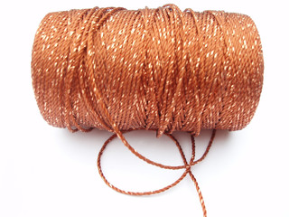 cone with orange and golden thread