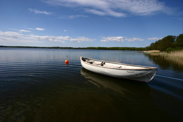 Naklejka na ściany i meble boat on a lake