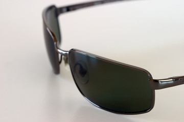 sunglasses on a white surface