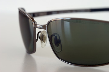 sunglasses on a white surface