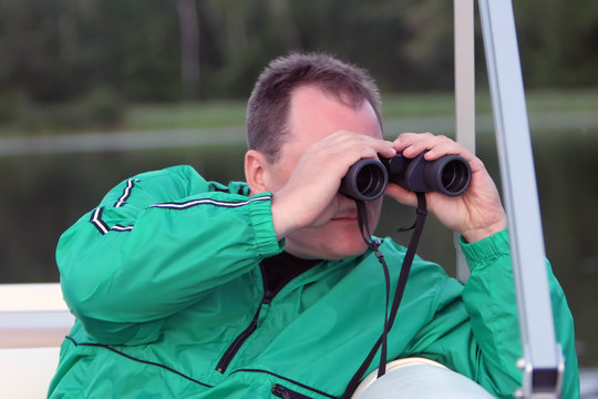 Man With Binoculars On Boat