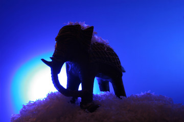 silhouette of a toy elephant.