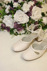 wedding shoes and white flowers
