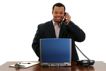 business man with laptop on phone