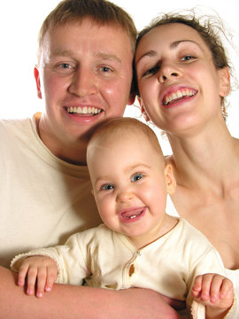 smiling family of three