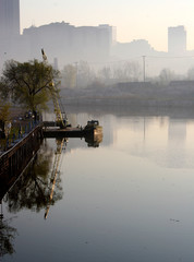 boat on a river with cleveland skyline