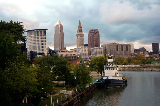 skyline of cleveland, ohio with boat on the cuyaho