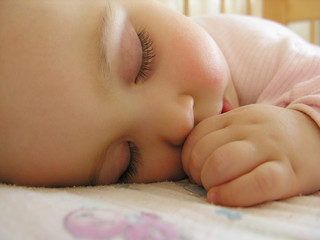 sleeping baby with hand