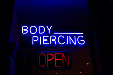 body piercing sign