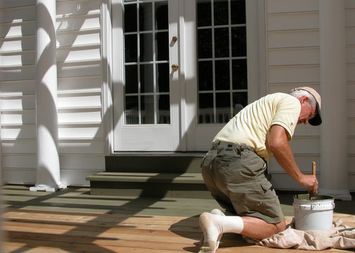 Man Staining A Deck 3