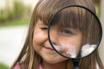 girl with magnifying glass