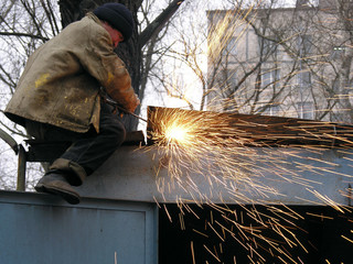 Fototapeta a construction worker welding steel obraz