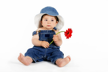 child with a red daisy