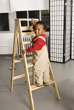 Baby Climbing A Ladder