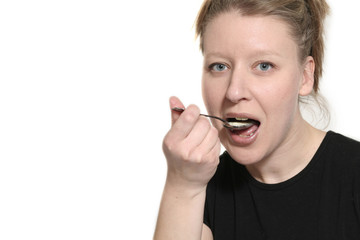 woman eating with spoon