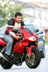Fototapeta na wymiar man on a red bike