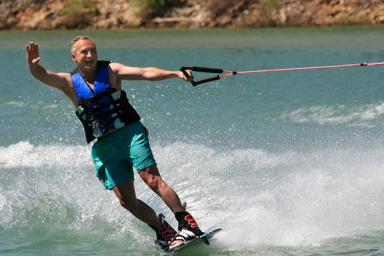 middleage man wakeboarding