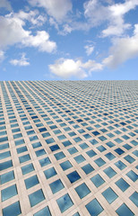 blue sky and clouds above corporate building