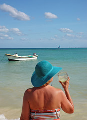 Fototapeta na wymiar lady with a margarita on the beach