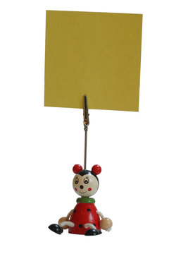 ladybug holding up a yellow note
