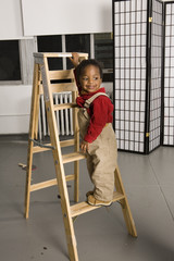 smiling baby on a ladder