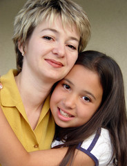 cute girl hugging her mother