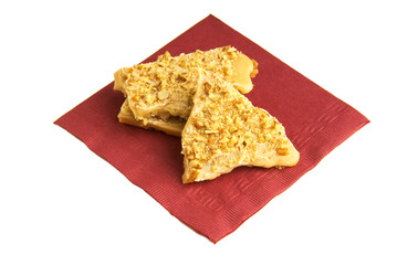 toffee on burgundy napkin