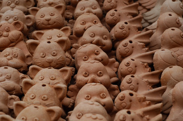 terracotta cats and birds