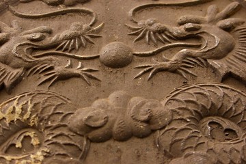 two dragons in stone relief