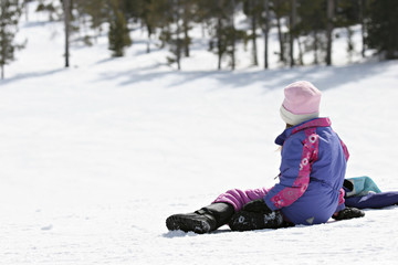 Fototapeta na wymiar girl waiting on snowy hill